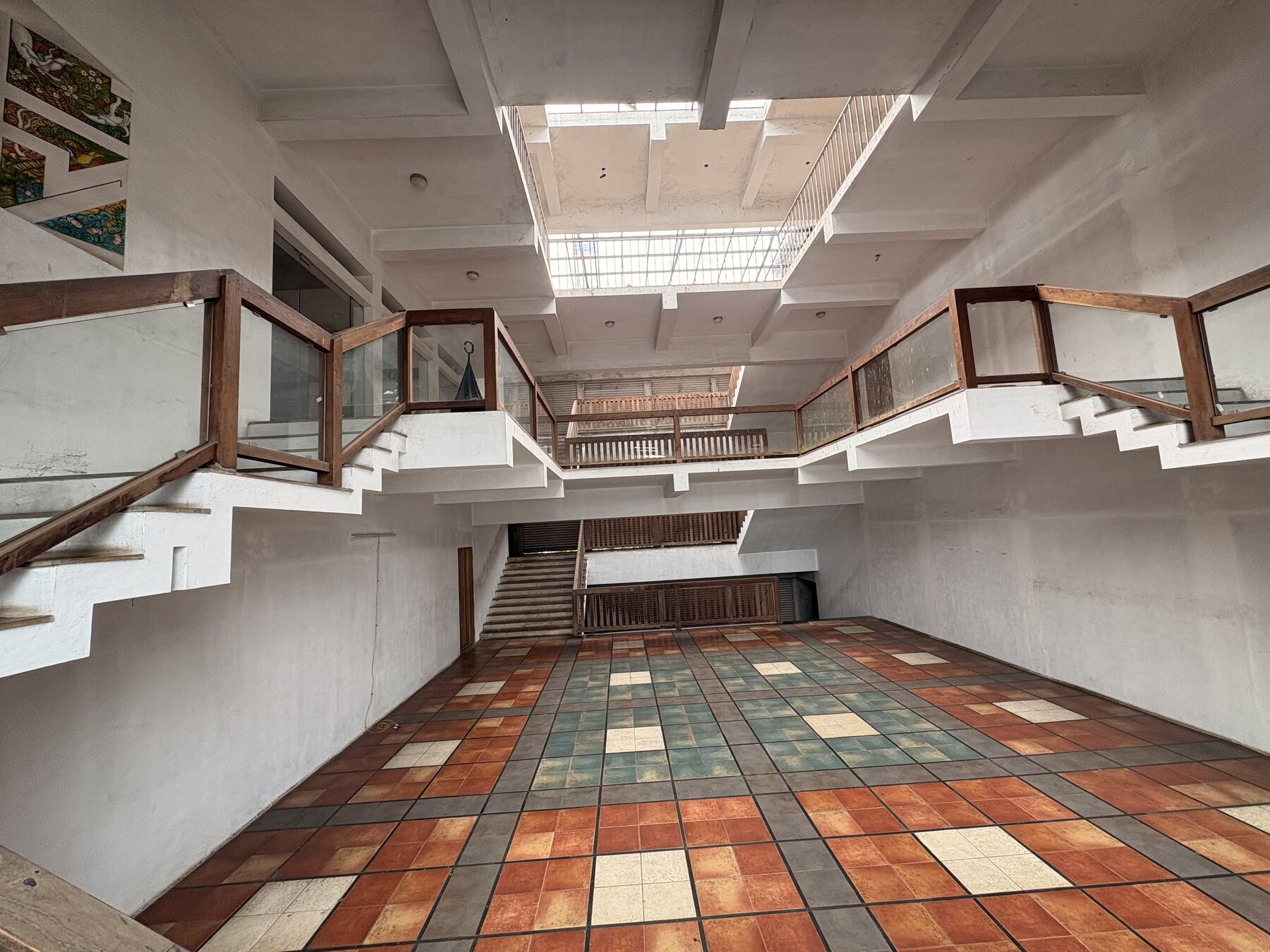 Central court floor with open staircases and skylight